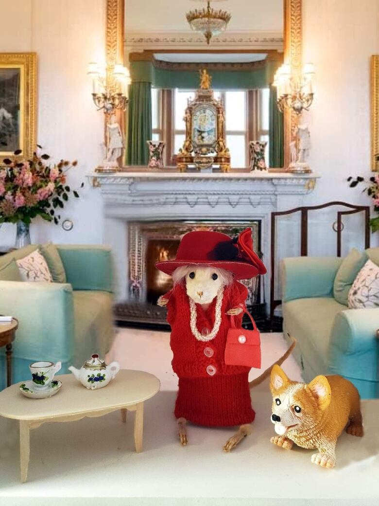 A taxidermied rat posed in front of a sitting room, with a teaset and a toy dog next to it.