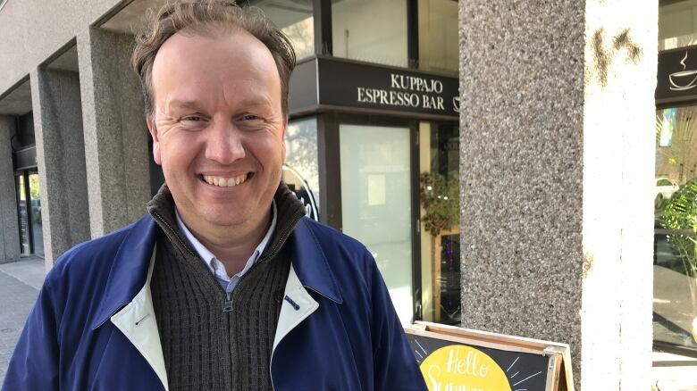 Paul Lefebvre stands in front of a downtown Sudbury cafe on a cool autumn afternoon.