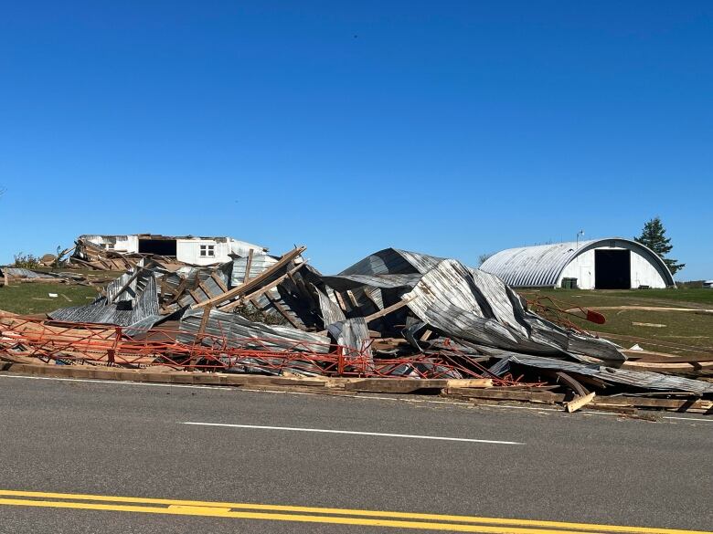 The remnants of a barn are seen