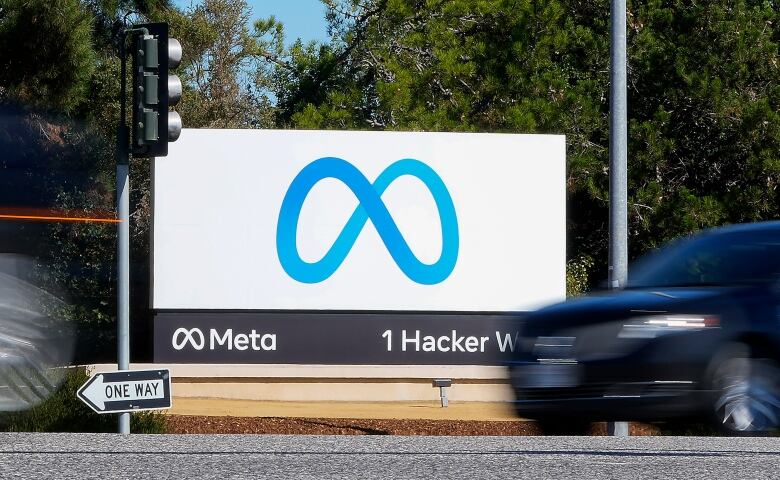 A company sign with a blue infinity symbol.