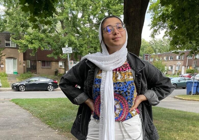 A woman poses for the camera.