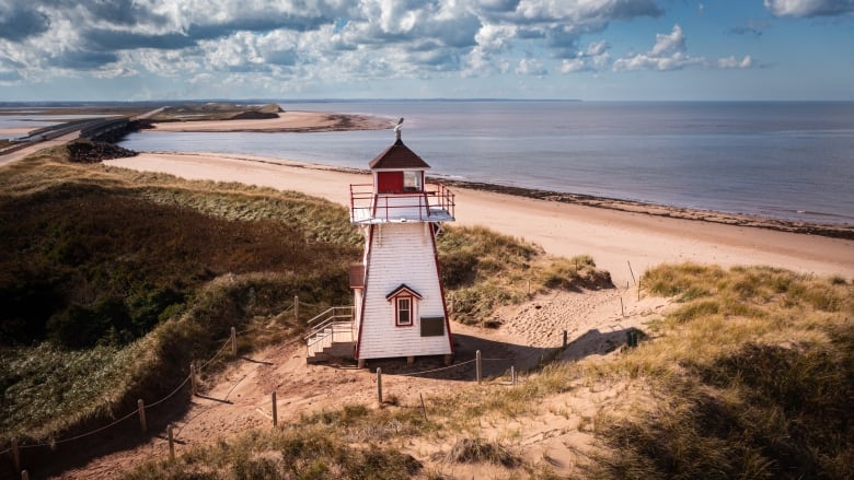 A lighthouse on a beach