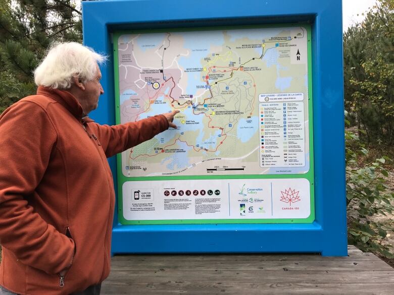 Peter Beckett points to a map of Laurentian's green space.