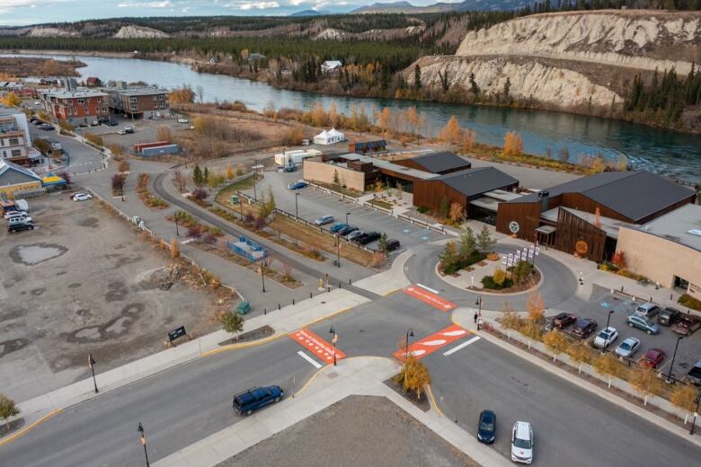 A drone shot of the city of Whitehorse and the intersection with the three orange crosswalks