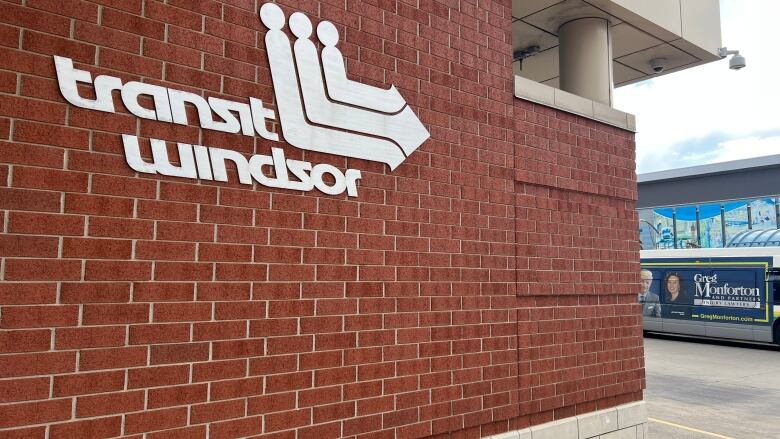 A brick wall that features the Transit Windsor logo.