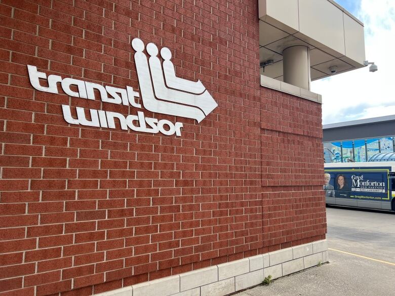 A brick wall that features the Transit Windsor logo.