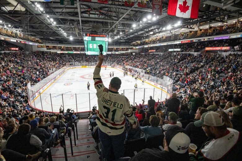 A Halifax Mooseheads fan celebrates a goal during the Oct. 1, 2022, game between the Mooseheads and the Cape Breton Eagles at the Scotiabank Centre in Halifax.