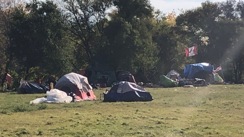 A picture shows tents set up in a field.