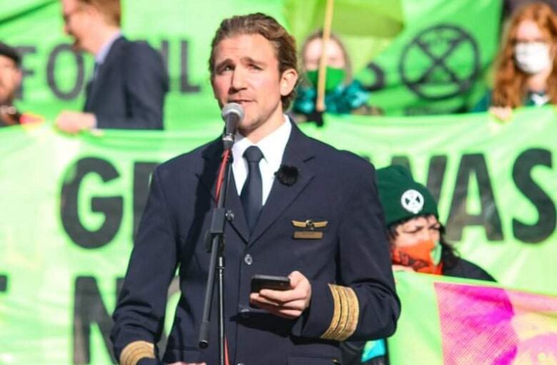 Man in pilot uniform.