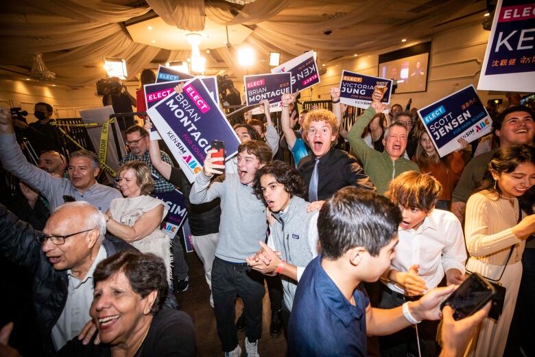 Supporters of Ken Sim are pictured celebrating at his election night party in Vancouver, B.C. on Saturday, Oct. 15, 2022. 