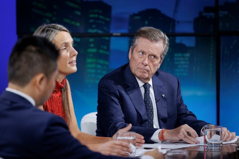 From right, Toronto mayoral candidates John Tory, Sarah Climenhaga and Jack Yan are pictured during the CARP mayoral debate, hosted by Zoomer radios Libby Znaimer, in Toronto, on Oct. 13, 2022.  Five mayoral candidates who hope to lead the next city council squared off at a debate organized by the seniors' group CARP on Thursday afternoon.