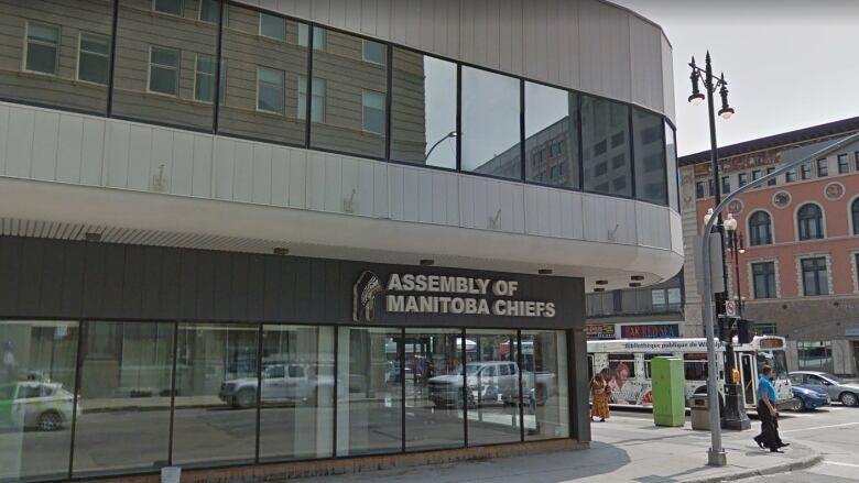 Exterior of a building at a street corner. A sign on the building says Assembly of Manitoba Chiefs.