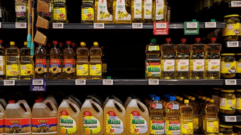 Bottles of cooking oil on shelves