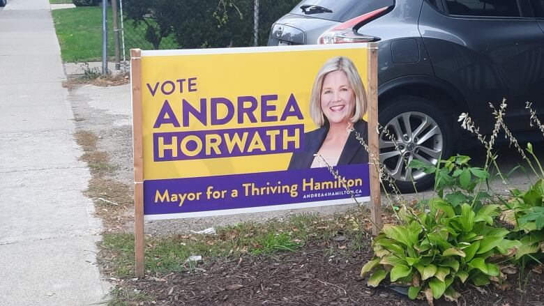 A flag depicting Andrea Horwath as they run for mayoral office in Hamilton.