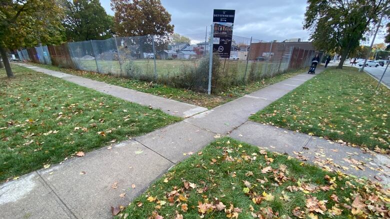 Sidewalks meet at the corner of the lot where the building is proposed to be built. 