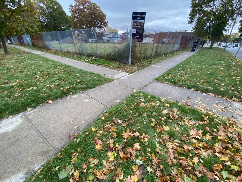 Sidewalks meet at the corner of the lot where the building is proposed to be built. 