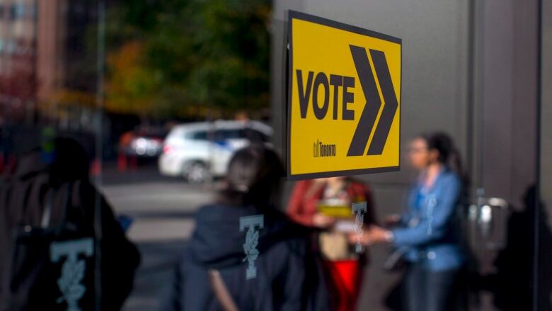 Voters line up outside a voting station to cast their ballot in the Toronto's municipal electionon Monday, October 22, 2018.