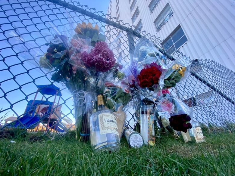 Flowers were laid steps from the building where Ramroop fell to his death on Oct. 13.