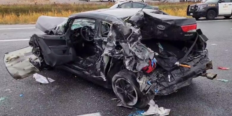 A badly damaged car. 