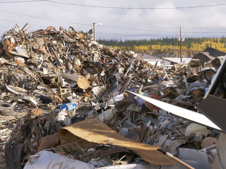 A variety of waste materials strewn in piles.