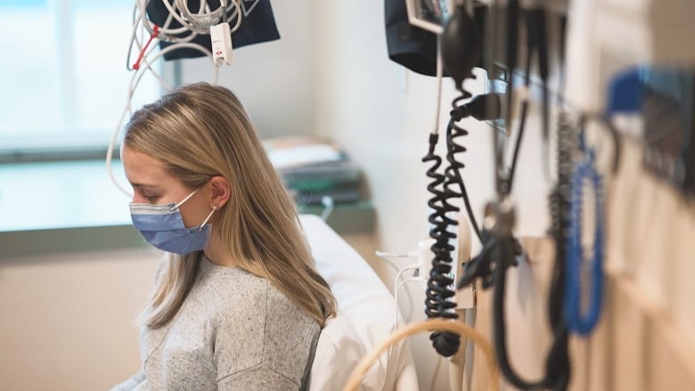 Halifax resident Amy Mullin relaxes in her isolation room, midway through her time participating in a human challenge trial to study whooping cough.