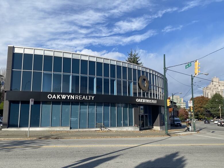 A glass-fronted building with the text 'Oakwyn Realty'.