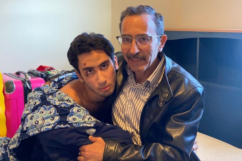 Majd Darwich (right) says his son Abdullah hasn't been the same since he was tasered and handcuffed by police on Friday after wandering away from home. The incident also left the 19-year old, who is autistic and non-verbal, with cuts, bruises and sores from the tasers.