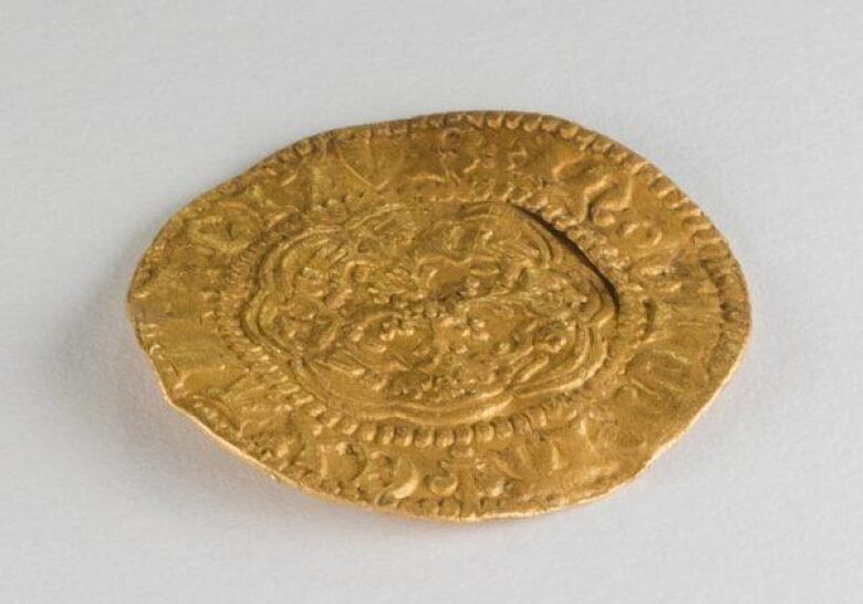 A beat-up gold coin.