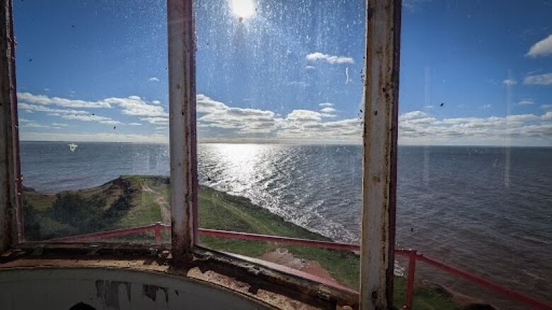 A view of the ocean from the top windows of the lighthouse. 