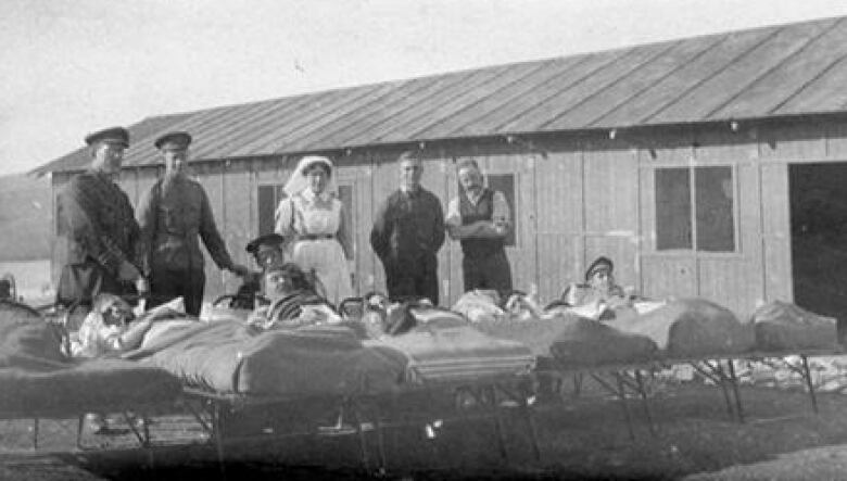 An archival image of hospital beds.