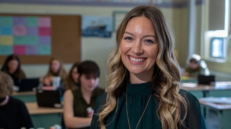 A teacher in front of a classroom.