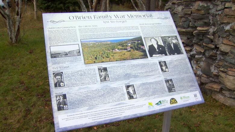 A storyboard next to the memorial grotto.