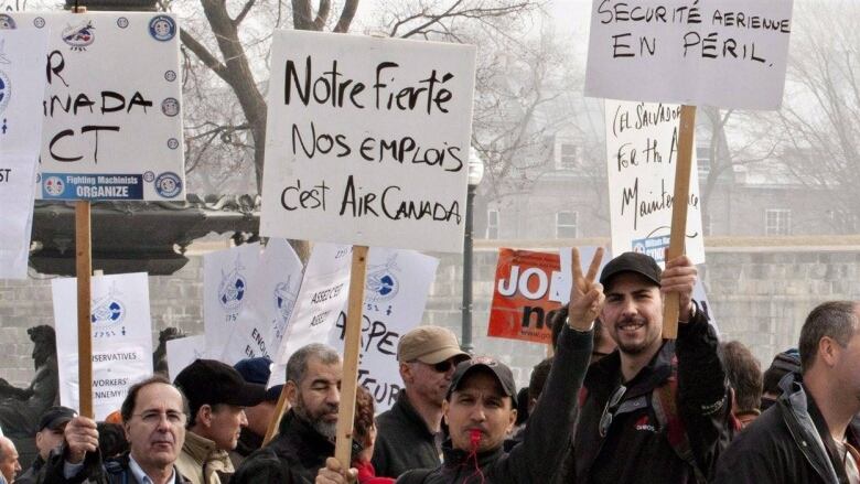 Protesters with signs