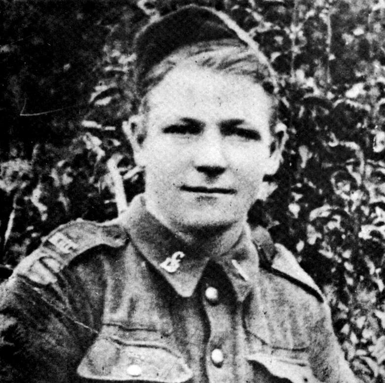 Black and white image of a young man in uniform in World War One.