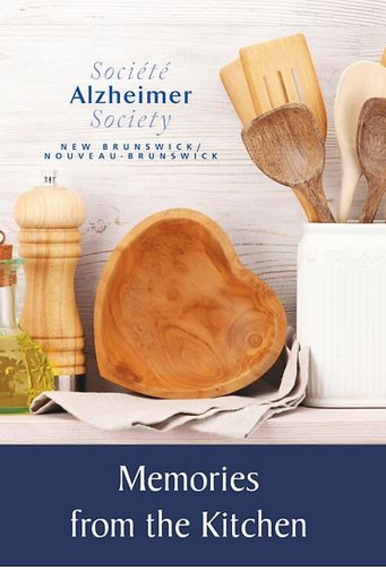 Book cover with wooden bowls and kitchen utensils on it. The top left corner says 