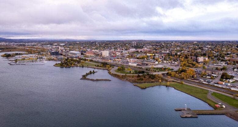 A drone photo is taken from the air showing the shore of Lake Superior and the city of Thunder Bay.