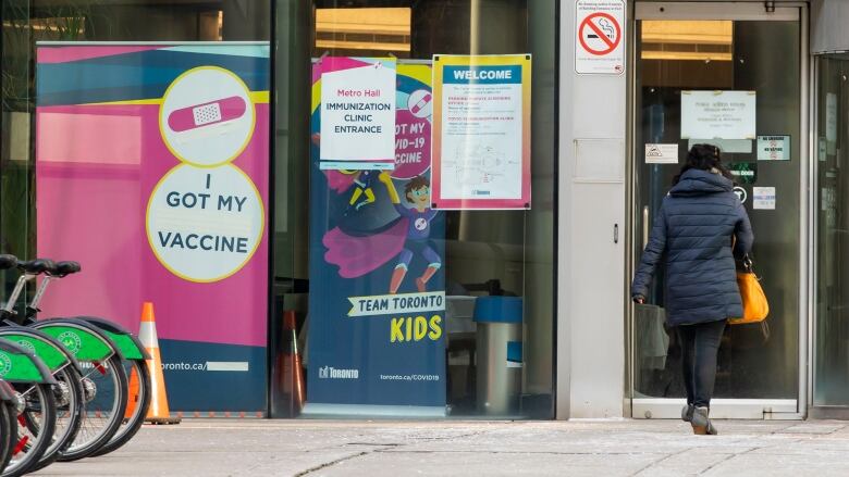 Someone entering the COVID-19 vaccine clinic in Metro Hall.