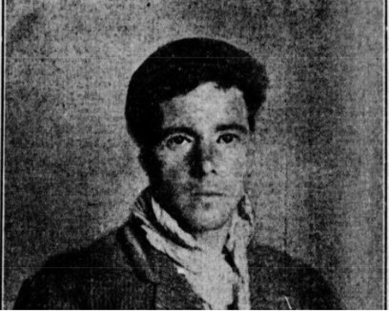 black and white photo of young man with short brown hair