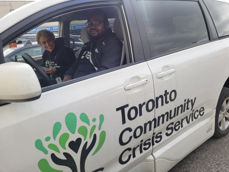 Tree logo and Toronto Community Crisis Service printed on a vehicle.