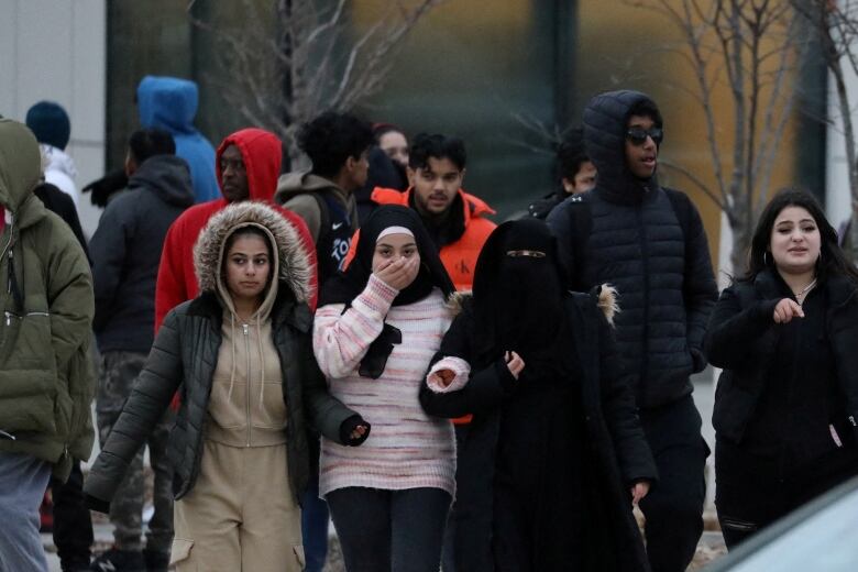 Students are seen outside the school.