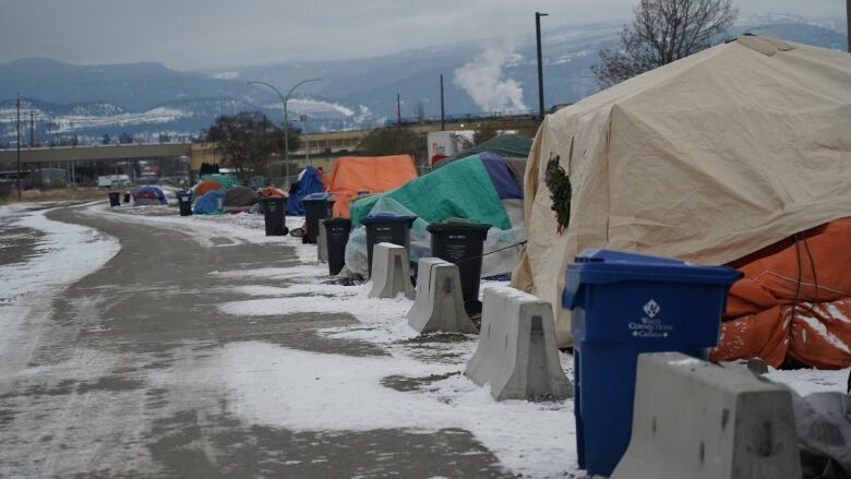 A series of tents in a snowy environment.