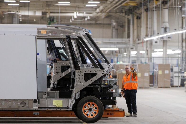 Workers assemble the components of a BrightDrop delivery van at General Motorss CAMI EV plant, in Ingersoll, Ont., on Nov. 29, 2022.