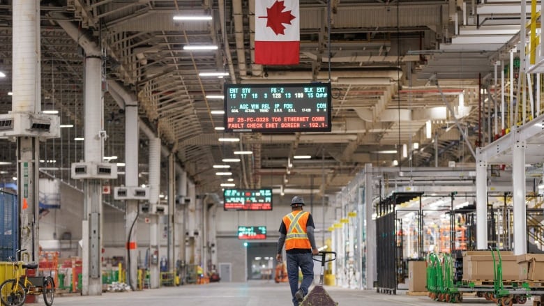 Workers assemble the components of a BrightDrop delivery van at General Motorss CAMI EV plant, in Ingersoll, Ont., on Nov. 29, 2022. 