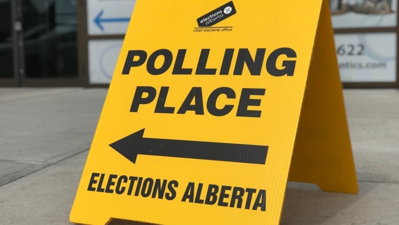 A yellow polling sign shows the Elections Alberta logo and an arrow.