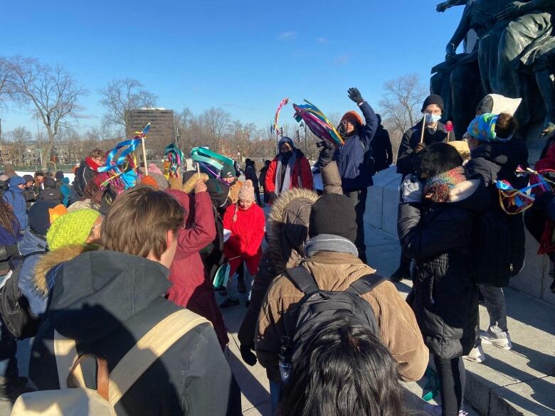 protesters gathered at the Mont-Royal statue in Montreal