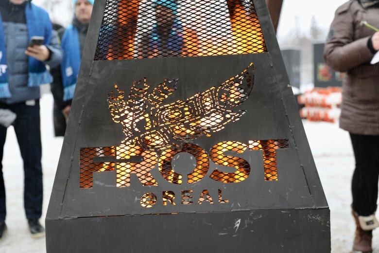 A fire burns in a custom made Frost fire pit during an announcement at Pat Fiacco Plaza on Dec. 12, 2022. 