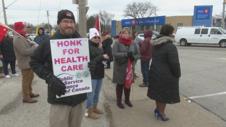 Protesters with the Windsor-Essex Health Care Coalition joined in a noon time protest against the privatization of health care along with protestors in Toronto, Waterloo, Niagara and Ottawa Monday.