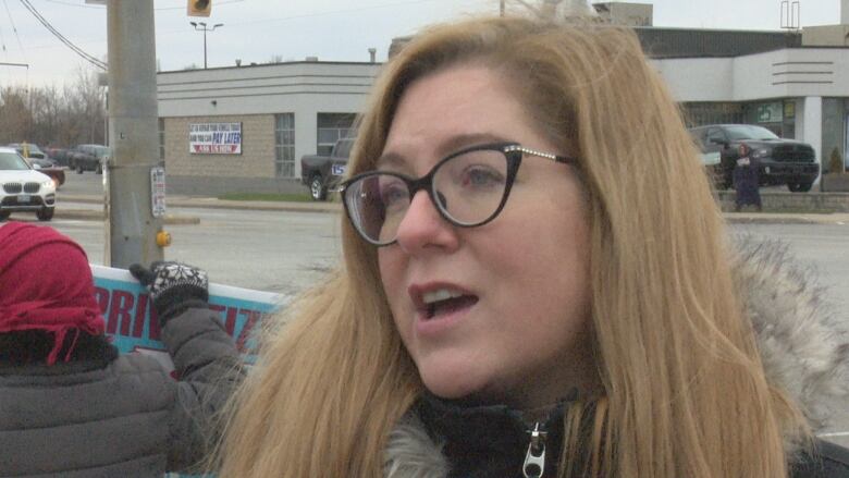 Tracey Ramsey, co-chair of the Windsor-Essex Health Care Coalition, lead a protest against privatization Monday.