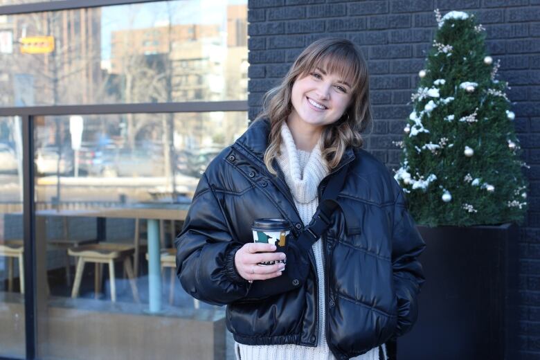 Bree Woolard is pictured outside a coffee shop in Calgary.