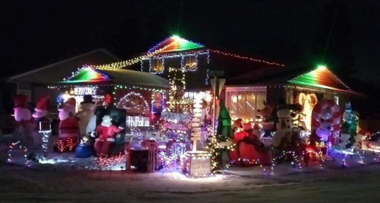 Dozens of lights, inflatable decorations and displays light up a Calgary home with holiday cheer.